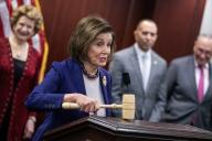 UNITED STATES - MARCH 21: Former Speaker Nancy Pelosi, D-Calif., holds the gavel she used after the House passed the Affordable Care Act in 2010, during an event to mark the ACAâs 14th anniversary in the U.S. Capitol on Thursday, March 21, 2024. Also appearing are Senate Majority Leader Charles Schumer, D-N.Y., right, House Minority Leader Hakeem Jeffries, D-N.Y., and Sen. Debbie Stabenow, D-Mich. (Tom Williams/CQ Roll Call