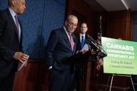 UNITED STATES - MAY 1: Senate Majority Leader Charles Schumer, D-N.Y., center, Sens. Cory Booker, D-N.J., left, and Ron Wyden, D-Ore., conduct a news conference on reintroduction of the "Cannabis Administration and Opportunity Act (CAOA)," in Capitol Visitor Center on Wednesday, May 1, 2024. The legislation would remove cannabis from the Controlled Substances Act, among other actions. (Tom Williams\/CQ Roll Call