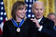 UNITED STATES - MAY 3: President Joe Biden presents swimmer Katie Ledecky, seven-time Olympic gold medalist, a Presidential Medal of Freedom, the nation\'s highest civilian honor, in the East Room of the White House on Friday, May 3, 2024. (Tom Williams\/CQ Roll Call