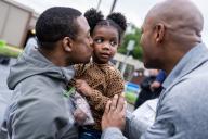 UNITED STATES - MAY 14: Gov. Wes Moore, D-Md., talks with Marlin Jenkins, and his daughter Seven, 3 years old, during a voter meet and greet with Angela Alsobrooks, Democratic U.S. Senate candidate from Maryland, on the stateâs primary election day at Lewisdale Elementary School in Chillum, Md., on Tuesday, May 14, 2024.(Tom Williams/CQ Roll Call