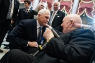 UNITED STATES - MAY 16: Former Vice President Mike Pence, left, talks with Glenn Wilcox, Sr., a friend of the Rev. Billy Graham, during the unveiling ceremony for the statue of Graham in the U.S. Capitolâs Statuary Hall on Thursday, May 16, 2024. (Tom Williams\/CQ Roll Call