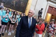 UNITED STATES - MAY 16: Former Vice President Mike Pence talks with tourists after the unveiling ceremony for the statue of Rev. Billy Graham in the U.S. Capitolâs Statuary Hall on Thursday, May 16, 2024. (Tom Williams/CQ Roll Call