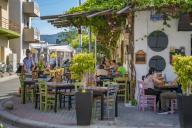 View of colourful cafe and restaurant in Kos Town, Kos, Dodecanese, Greek Islands, Greece, Europe