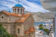 View of Holy Church of Saint Nicholas and harbour in the background, Kalimnos, Dodecanese Islands, Greek Islands, Greece, Europe