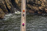 View of people crossing suspension bridge at Storms River, Tsitsikamma National Park, Garden Route National Park, South Africa, Africa