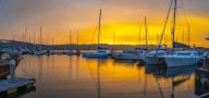 View of golden sunset and boats at Knysna Waterfront, Knysna, Western Cape Province, South Africa, Africa