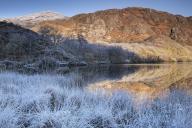 Freezing conditions at Llyn Dinas in winter, near Beddgelert, Snowdonia National Park (Eryri), North Wales, United Kingdom, Europe