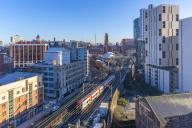 Elevated view of city skyline from Tony Wilson Place, Manchester, Lancashire, England, United Kingdom, Europe