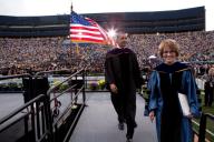 President Barack Obama exits the stage with University of Michigan president Mary Sue Coleman, after delivering the commencement address to University of Michigan graduates at Michigan Stadium, in Ann Arbor, Mich., May 1, 2010. (Pete Souza/ PSG)