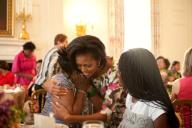 First Lady Michelle Obama greets guests during a Mother