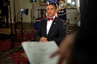 President Barack Obama, wearing a bow tie similar to Supreme Court Justice Paul Stevens, tapes a message regarding the justice