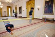First Lady Michelle Obama participates in a potato sack race with Jimmy Fallon in the East Room of the White House during a ÒLate Night with Jimmy FallonÓ taping for the second anniversary of the "LetÕs Move!" initiative, Jan. 25, 2012. (Official ...