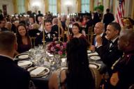 President Barack Obama talks with members of the military and guests during a Department of Defense dinner in the East Room of the White House, Feb. 29, 2012. The President and First Lady hosted the dinner to honor members of the Armed Forces who ...