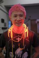 Jive Lau Ho-fai (pink hair) teaches a neon bending workshop to writer Sarah Vega at Kowloneon, a neon workspace in Kwun Tong, Hong Kong, on 19 August 2022. 19AUG22 SCMP / Connor