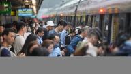 People board a train at Tai Wai station commuting to work after Hong Kong Observatory has lowered the typhoon signal from no.8 to no.3, as Typhoon Koinu is departing the city. 09OCT23 SCMP / Elson