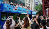 Members of the public greet the Hong Kong, China Delegation to the Tokyo 2020 Olympic Games on a bus parade to celebrate the athletesâ triumphant return with distinguished results, pictured in Nathan road,Tsim Sha Tsui. 19AUG21 SCMP / Robert