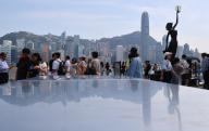 Tourists visit Tsim Sha Tsui waterfront under the hot weather. 15MAY24 SCMP \/ Jelly