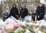 (210316) -- LONDON, March 16, 2021 (Xinhua) -- Women stand hand in hand next to floral tributes at the bandstand on Clapham Common to mourn for Sarah Everard in London, Britain, on March 15, 2021. A serving Metropolitan police officer on March 13 appeared in court in London after being charged with the kidnap and murder of a 33-year-old woman. Wayne Couzens, 48, was arrested after Sarah Everard, a marketing executive, went missing while walking home from a friend