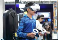 (240427) -- BEIJING, April 27, 2024 (Xinhua) -- A boy plays a VR game at a science fiction carnival alongside the China Science Fiction Convention (CSFC) 2024 in Beijing, capital of China, April 27, 2024. The CSFC 2024 kicked off Saturday at the Shougang Park in Beijing, with opening ceremony, forums, industry promotional events and film screenings scheduled. A science fiction carnival is also held during this year\'s convention. (Xinhua\/Zhang Chenlin) - Ren Chao -\/\/CHINENOUVELLE_CHINE1459\/Credit:CHINE NOUVELLE\/SIPA