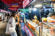(240513) -- GENEVA, May 13, 2024 (Xinhua) -- Tourists visit a night market at Chengguan District in Lanzhou, capital of northwest China