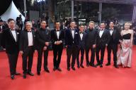 Angus Chan, Victor Hadida, German Cheung, Louis Koo, Soi Cheang, Chai-Tuck Yip, Terrance Lau, Raymond Lam, Tony Wu and Kinnie Cheung attending the Twilight Of The Warriors: Walled In (City Of Darkness)" red carpet during the 77th annual Cannes Film Festival at the Palais des Festivals, in Cannes France, on May 16 2024.//03HAEDRICHJM_JMH.0010/Credit:JM HAEDRICH/SIPA