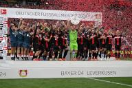 (240519) -- LEVERKUSEN, May 19, 2024 (Xinhua) -- Lukas Hradecky (C), goalkeeper of Bayer 04 Leverkusen, holds the trophy during the celebration for winning the title of German first division Bundesliga in Leverkusen, Germany, May 18, 2024. (Photo by Ulrich Hufnagel\/Xinhua) - Ulrich Hufnagel -\/\/CHINENOUVELLE_XxjpbeE007042_20240519_PEPFN0A001\/Credit:CHINE NOUVELLE\/SIPA