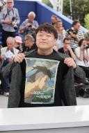 Kenichi Yoda attends a photocall for the Palme D