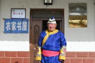 (240520) -- LANZHOU, May 20, 2024 (Xinhua) -- An Weizhi stands in front of his library in Sunan Yugur Autonomous County of Zhangye City, northwest China