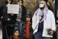 Dr. Mustafa Mahmood, a family-practice physician originally from Iraq, stands with two of his children. About 100-200 demonstrators, many of whom are health-care providers in the Portland, Oregon area, protested on February 23, 2024, at Sen. Ron Wyden