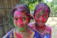 26 March 2024 Sylhet - Bangladesh: Children at a tea garden with painted faces in rainbow colours celebrating the annual Hindu festival of colors, known as Holi festival, marking the onset of spring. On 26 March 2024 Sylhet, Bangladesh (Photo by Md Rafayat Haque Khan\/ Eyepix Group\/Sipa USA