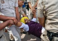 New Delhi, March 26, 2024 (ANI): Police personnel detain an AAP supporter during the protest to Gherao PM Modi\'s residence against the arrest of Delhi Chief Minister Arvind Kejriwal in a liquor policy case, outside Patel Chowk Metro Station, in New Delhi on Tuesday. (ANI Photo via Hindustan Times\/Sipa USA\/Rahul Singh