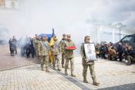 Ukrainian service members carry a coffin with the body of their brother-in-arms and public figure Pavlo Petrychenko, who was killed in a fight against Russian troops in Eastern Ukraine, during a funeral ceremony in Kyiv. (Photo by Oleksii Chumachenko \/ SOPA Image\/Sipa USA