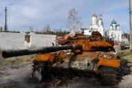 A destroyed Russian tank stands by the road in front of an orthodox temple in the liberated town of Sviatohirsk. Russia is losing from 50 to 100 soldiers each day in the battle of Bakhmut amid its desperate attempts to capture the city in the eastern Donetsk Oblast, a military spokesman said on Dec. 4. Speaking on TV, Eastern Military Command spokesman Serhiy Cherevaty said that about as many Russian soldiers get wounded in action near Bakhmut daily. For months, Russia has massed troops and equipment to surround and capture Bakhmut in a brutal campaign participated by the Russian state-backed military company Wagner Group. (Photo by Andriy Andriyenko / SOPA Images/Sipa USA