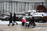 Women in wheelchairs talk close to destroyed Russian tanks on display in central Kyiv. Russian troops entered Ukraine on February 24, 2022 starting a conflict that has provoked destruction and a humanitarian crisis. (Photo by Oleksii Chumachenko / SOPA Image/Sipa USA