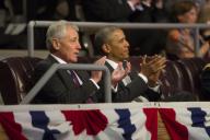 President Barack Obama and Secretary of Defense Chuck Hagel applaud after Chairman of the Joint Chiefs of Staff General Martin Dempsey delivers a speech during the Armed Forces Farewell Tribute to Secretary of Defense Chuck Hagel on Joint Base Myer-...