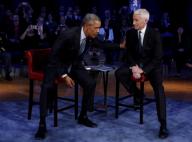 US President Barack Obama (L) during the commercial break of a live town hall event with CNN
