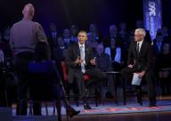 US President Barack Obama (C) listens to a question from Arizona Sheriff Paul Babeu during a live town hall event with CNN