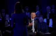 US President Barack Obama answers a question during a live town hall event with CNN