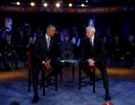 US President Barack Obama (L) during the commercial break of a live town hall event with CNN
