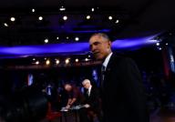 US President Barack Obama walks during the commercial break of a live town hall event with CNN