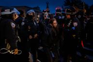 NEW YORK, NEW YORK - APRIL 23: Police detain protesters near the home of Senate Majority Leader Chuck Schumer