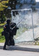 South Korean Police Special Operation Unite members detonates a glass door during a terror response drill of 2024 Chungmu exercise in Seoul. South Korea