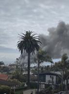 Oceanside Pier in downtown catches fire and emits large billowing smoke. (Photo by Jacob Lee Green\/Sipa USA