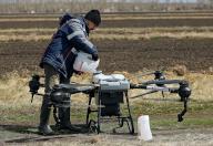 The first air show of agricultural drones "AltaiAgroBAS-2024" in the Altai Territory. An air show participant during the launch of a quadcopter. 24.04.2024 Russia, Altai, Barnaul Photo credit: Andrey Kasprishin\/Kommersant\/Sipa