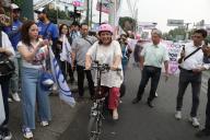 Xóchitl Gálvez, candidate for the presidency of Mexico for the Fuerza y ??Corazon por México coalition, arrives by bicycle at the event called \'Crucero Xingon\' to distribute political flyers in the intersection of Rio Churubusco and Universidad Avenue in the Benito Juárez mayor\'s office. on April 26, 2024 in Mexico City, Mexico. (Photo by Ismael Rosas\/ Eyepix Group\/Sipa USA