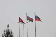 Turkish, Russian and Azerbaijan flags are waving during closing the Turkish-Russian Joint Monitoring Centre in the course of peacekeeping troops\' withdrawal from the territory of Karabakh region and areas nearby, in Aghdam District on April 26, 2024. (Photo by Aziz Karimov \/ SOPA Images\/Sipa USA