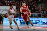 Hugo Besson #25 of Pallacanestro Varese OpenJobMetis (R) competes for the ball against Justin Robinson #12 of Nutribullet Treviso Basket (L) during LBA Lega Basket A 2023\/24 Regular Season game between Pallacanestro Varese OpenJobMetis and Nutribullet Treviso Basket at Itelyum Arena, Varese, Italy on April 28, 2024 (Photo by Fabrizio Carabelli\/IPA Sport \/ i\/IPA\/Sipa USA