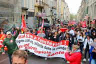 Protesters with a banner and flags march on Workers\' Day in the streets of Marseille. Unions demonstrated on the streets of downtown Marseille to celebrate Workers\' Day. Police estimate around 3,000 demonstrators joined the demonstration while unions say they gathered 8,000. The Interior Ministry reported around 121,000 demonstrators on the streets of France, while unions claim more than 210,000 demonstrators. (Photo by Denis Thaust \/ SOPA Images\/Sipa USA