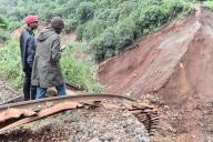 People look at the destroyed railway line after a tunnel uphill blocked by debris rapidly filled up with water leading to loss of wall integrity and eventual flooding that caused tragic loss of life, injuries and extensive damage to property downstream. The ongoing heavy rainfall has caused widespread flooding in Kenya. (Photo by James Wakibia \/ SOPA Images\/Sipa USA