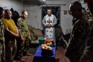A chaplain (center) blesses servicemen of Ukraine\'s 141st separate infantry brigade on Easter Eve near the frontline in Zaporizhzhia region. Ukrainians celebrate the Orthodox Easter, and the servicemen of Ukrainian armed forces adhere to national traditions even on the frontline. The Security Service of Ukraine warns of Russia\'s attempts to destabilize the situation in Ukraine through provocations, including the involvement of agents to commit interfaith provocations and adjusting hostile fire on civilian infrastructure during Easter celebrations. (Photo by Andriy Andriyenko \/ SOPA Images\/Sipa USA